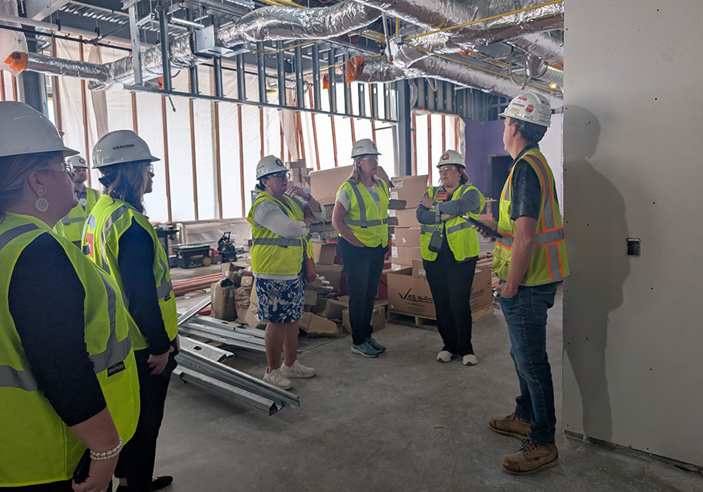 Group hearing about progress
