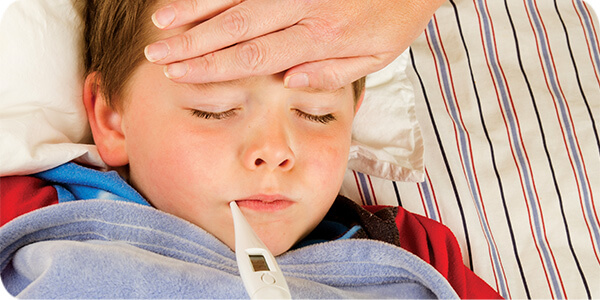 Sick kid with thermometer 