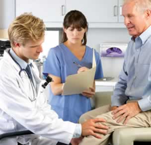 doctor examining patient's knee