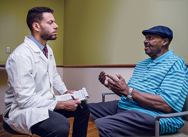 Dr. Omar Gayar with Patient