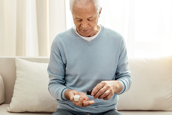 Man Taking Medication