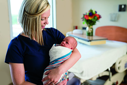 McLaren Flint midwife with newborn baby