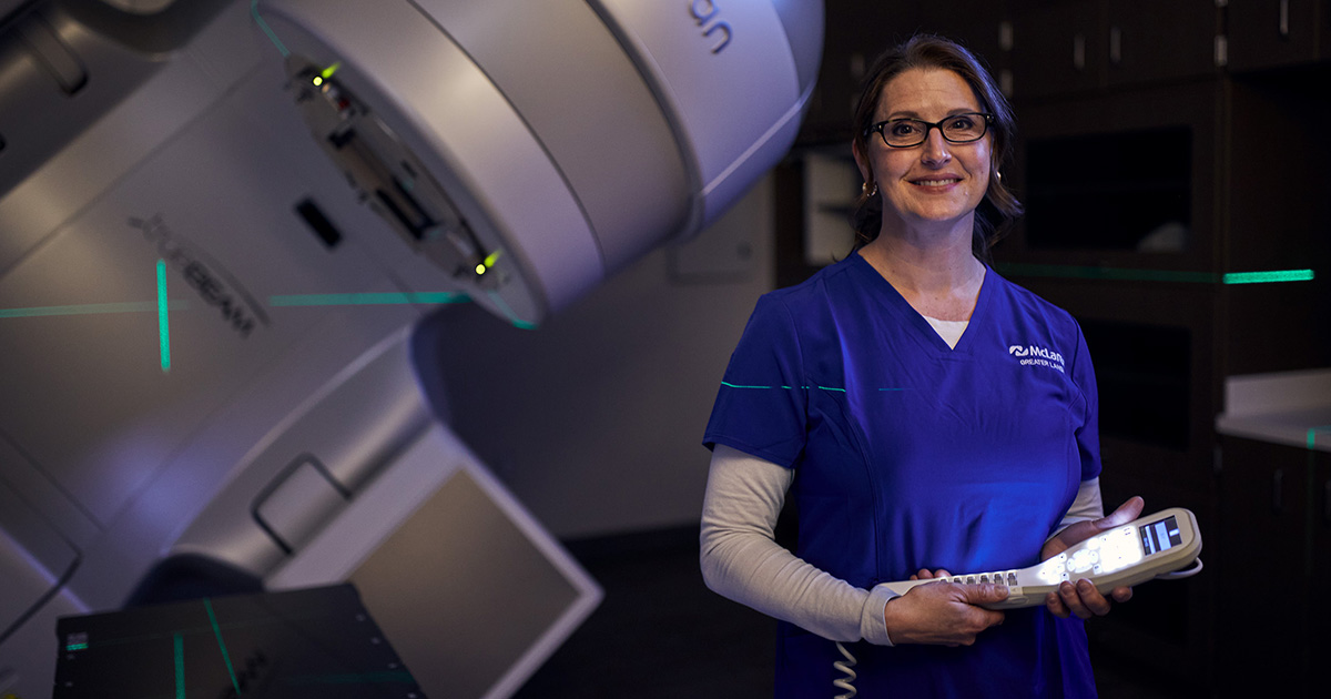 Woman radiation tech smiling at the camera