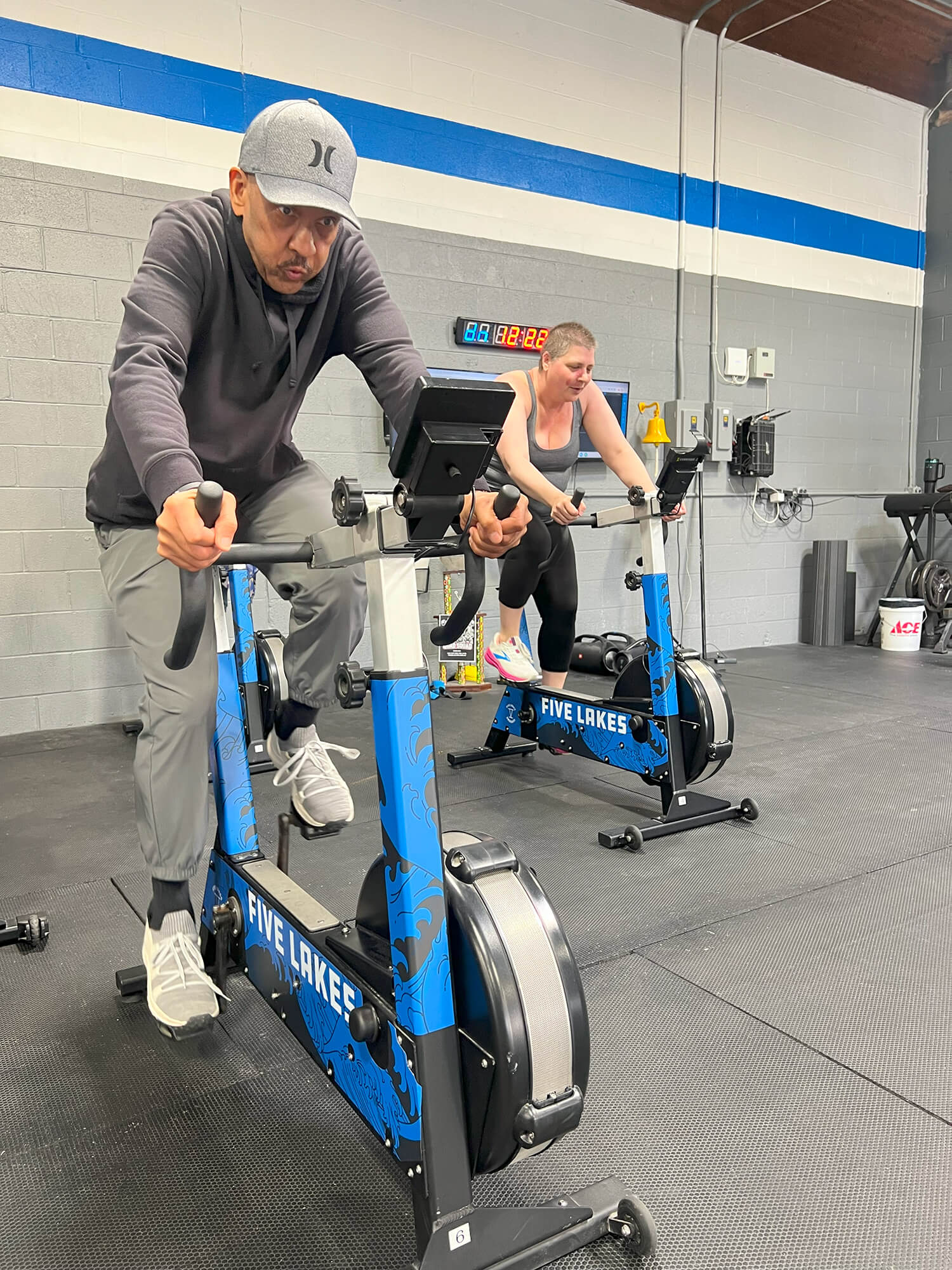 Participants at one of several CAPABLE sessions across Michigan ride exercise bikes at a CrossFit gym.