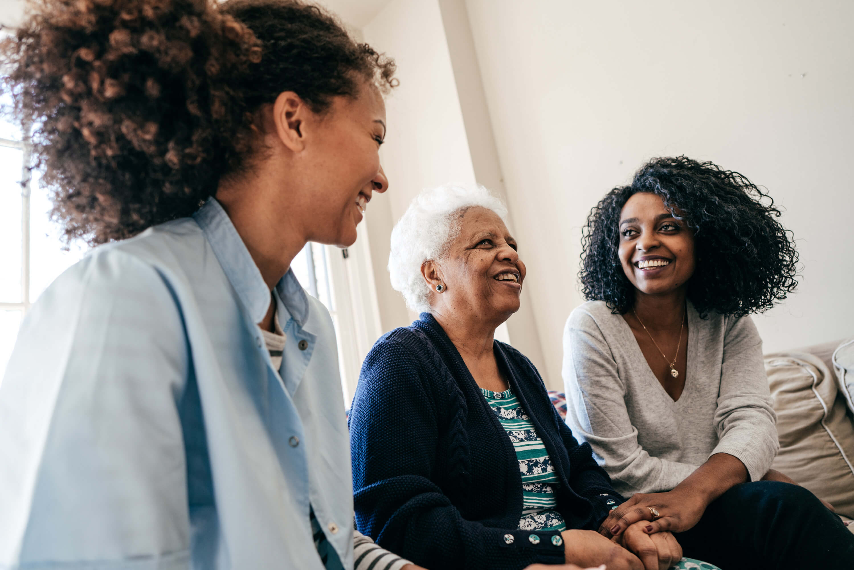 Two women with their grandmother