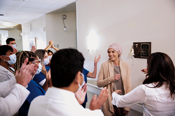 Karmanos patient celebrating with staff
