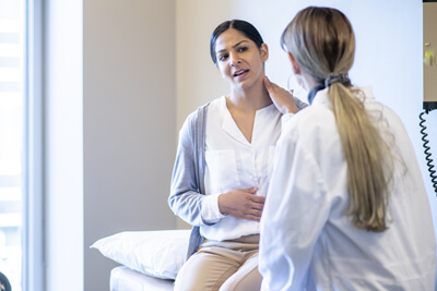 woman talking to doctor