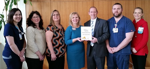 Group accepting the award from EAM organization