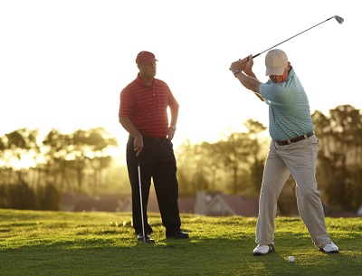 Two men golfing