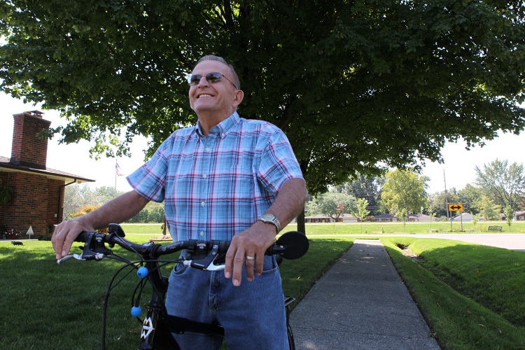 patient bob rising his bike