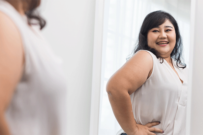 Woman smiling looking in the mirror