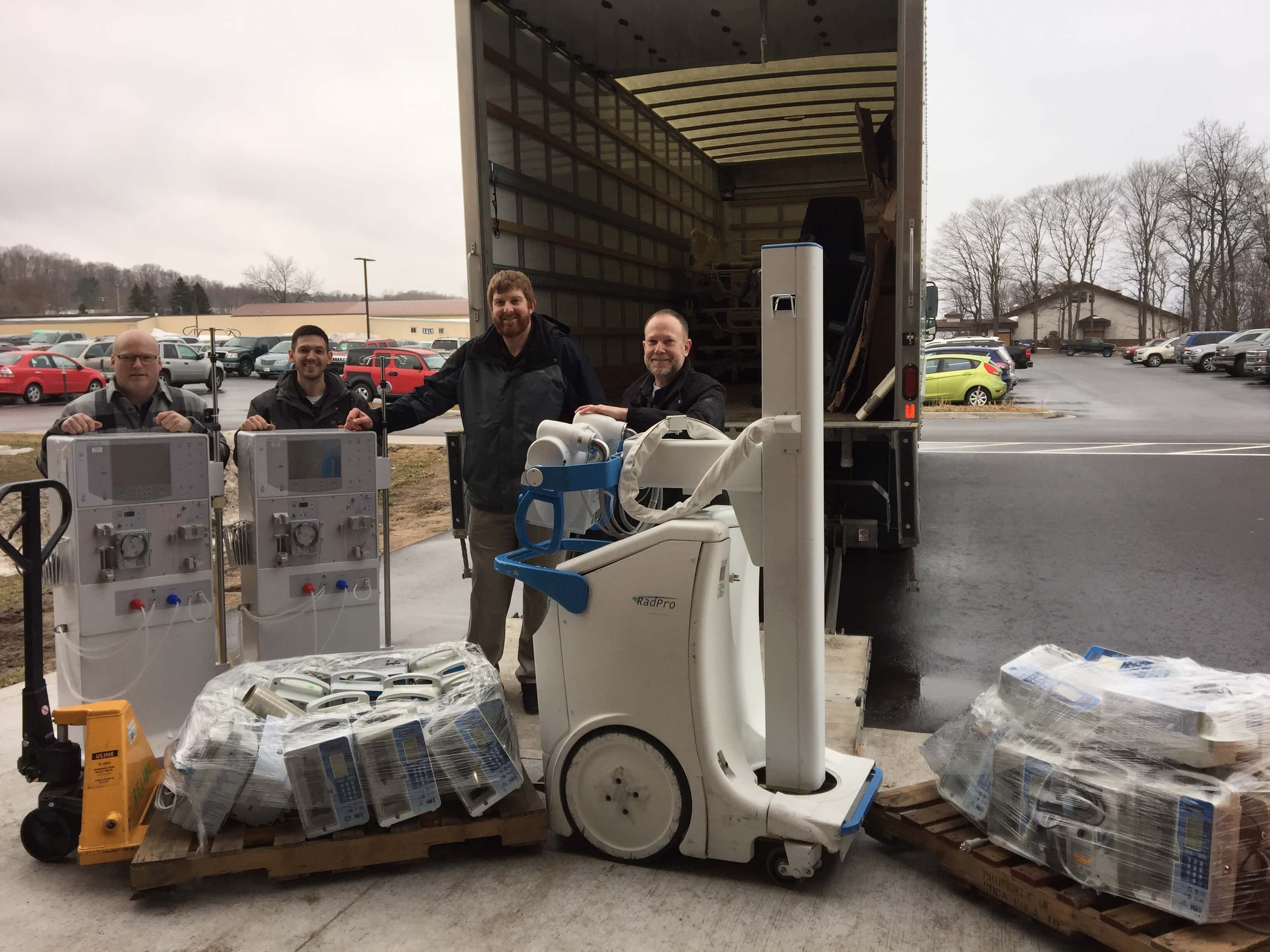 donated equipment with 4 men