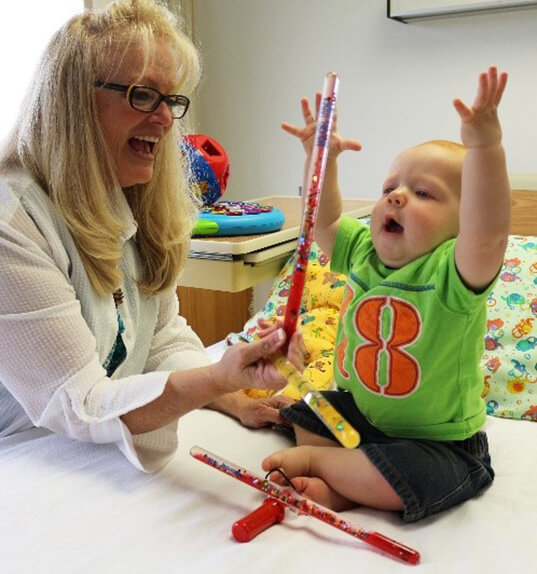 nurse playing with child
