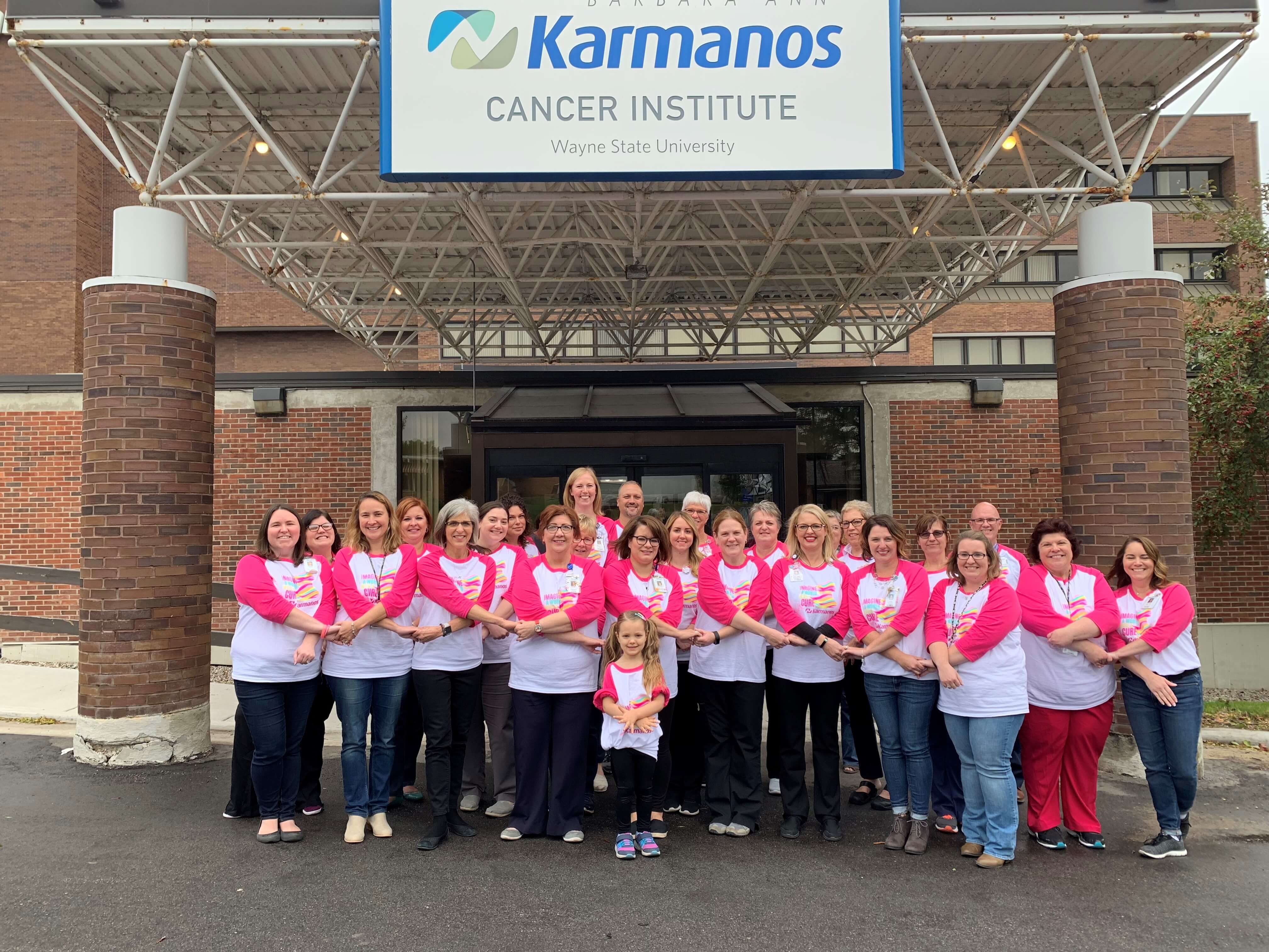 Karmanos colleagues pictured outside in matching breast cancer shirts