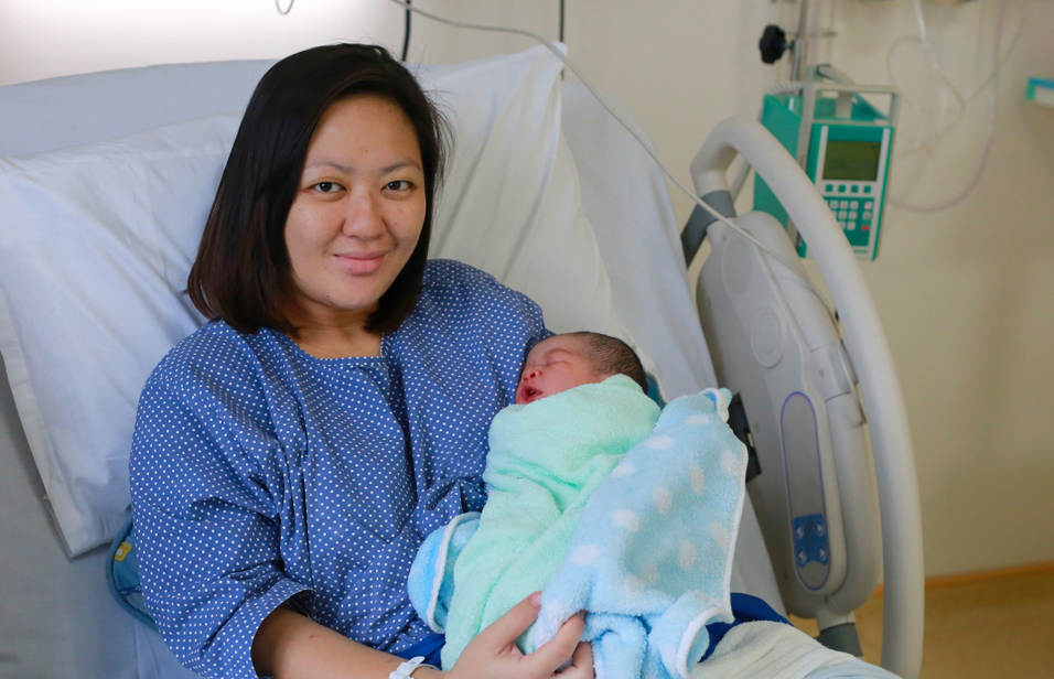 mom holding newborn baby