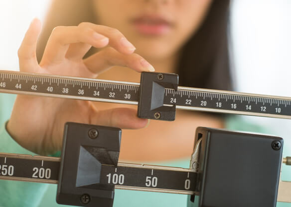 woman using scales