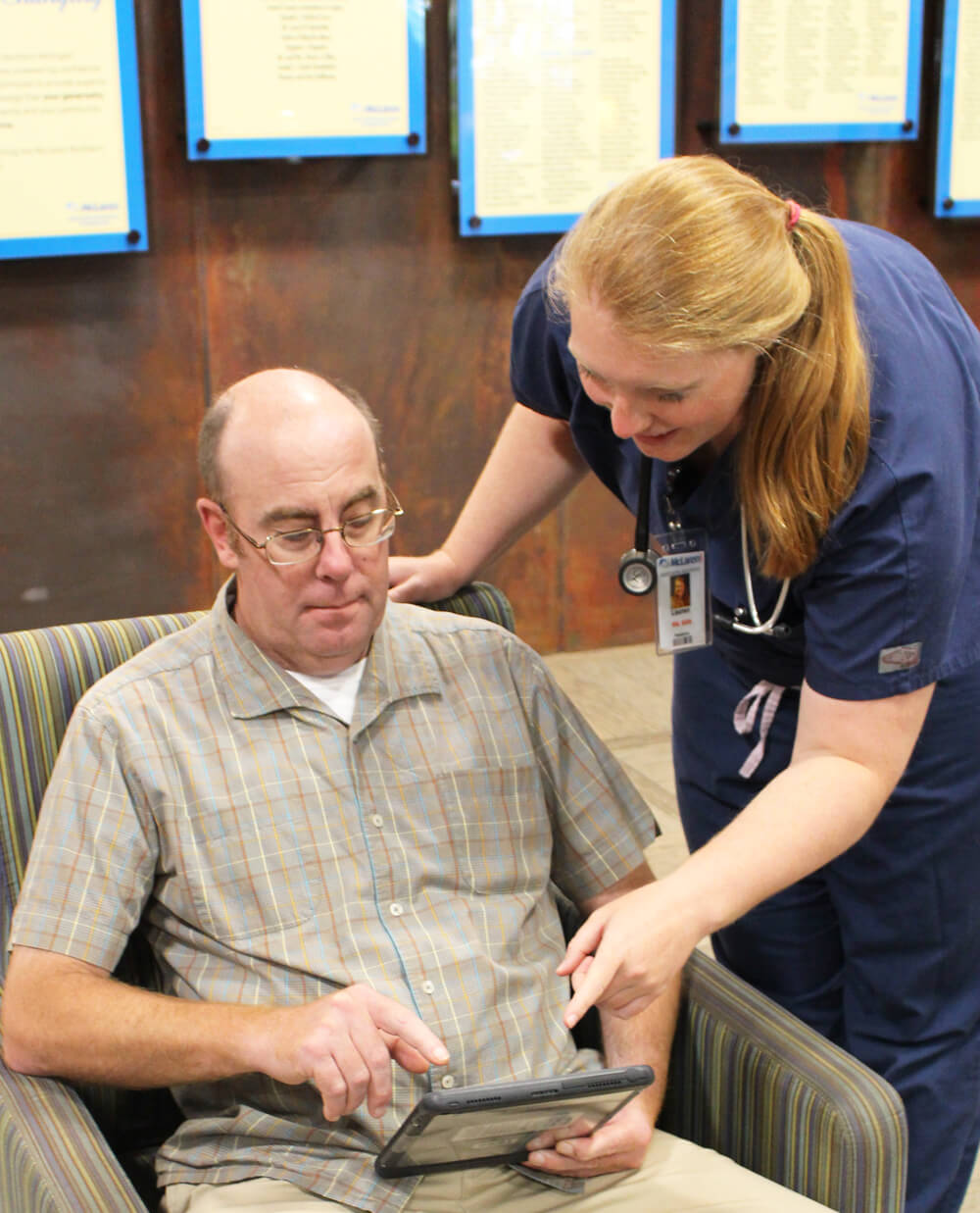 nurse and patient with tablet