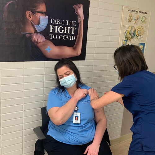 Nurse caring for patient A