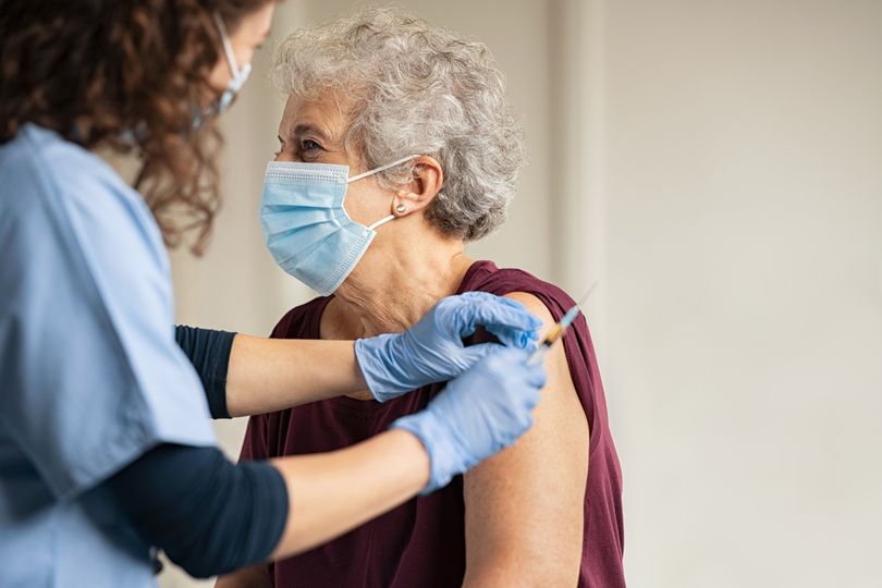 Doctor performing surgery with a team