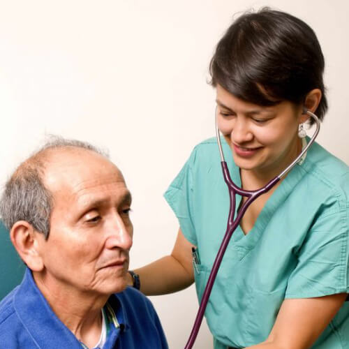 Doctor listening with stethoscope